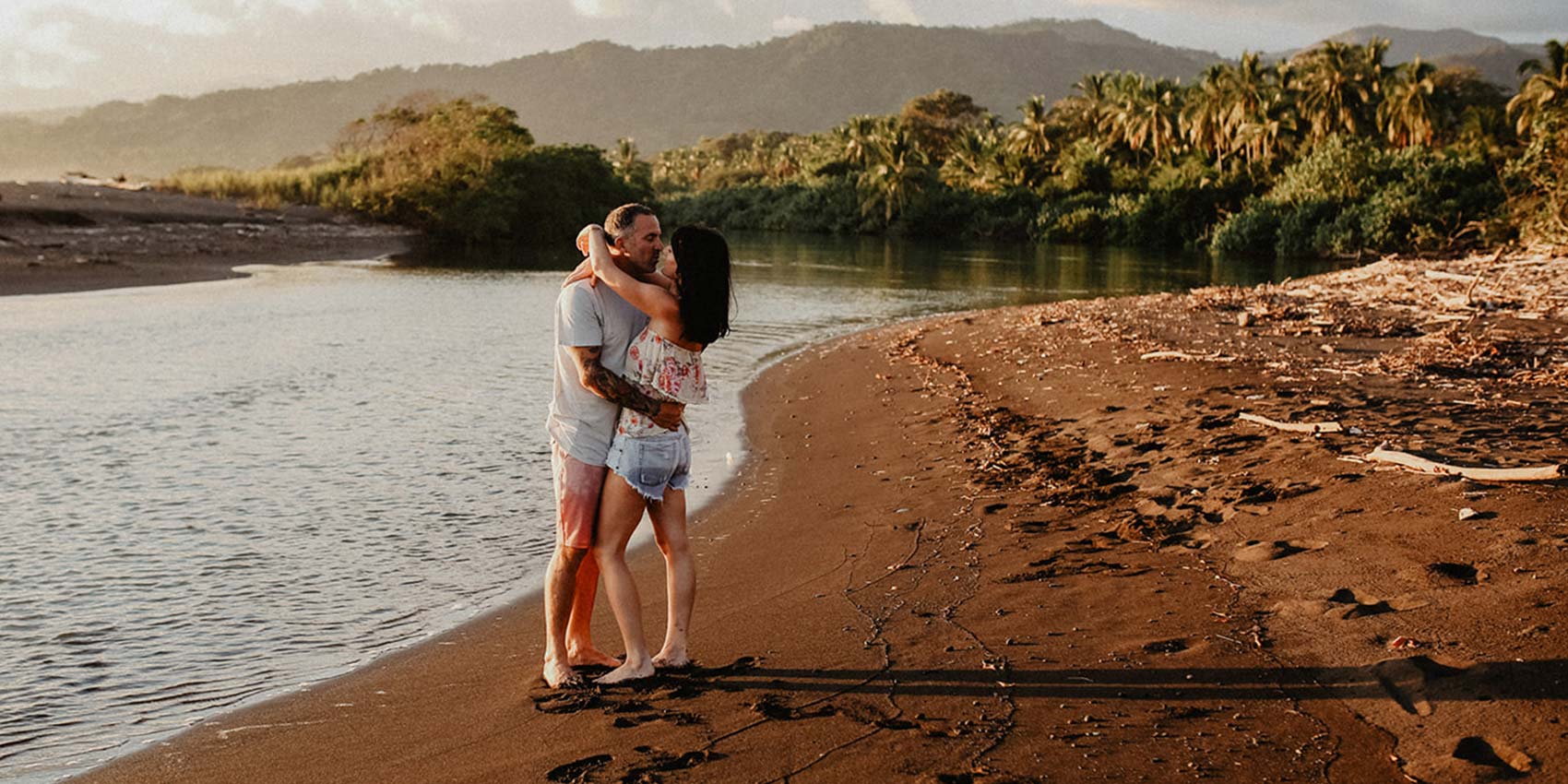 Lovers embrace on the beach