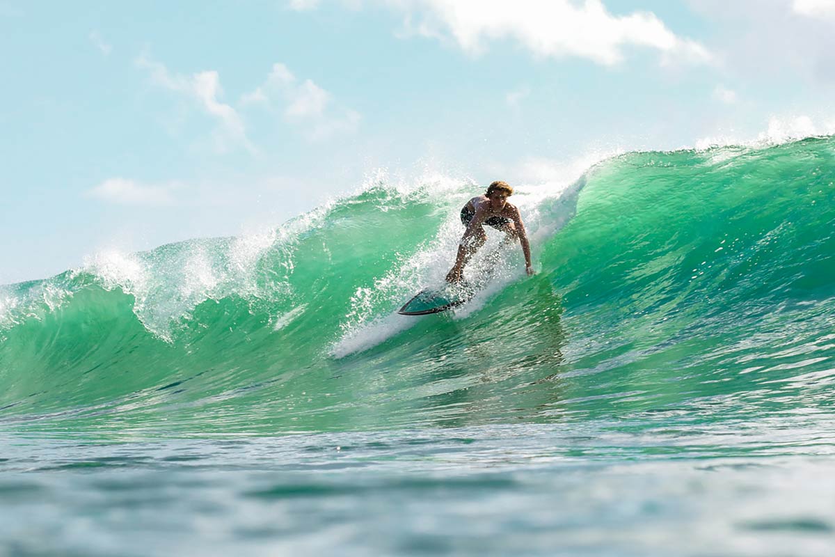 Local surfing green wave in Cambutal