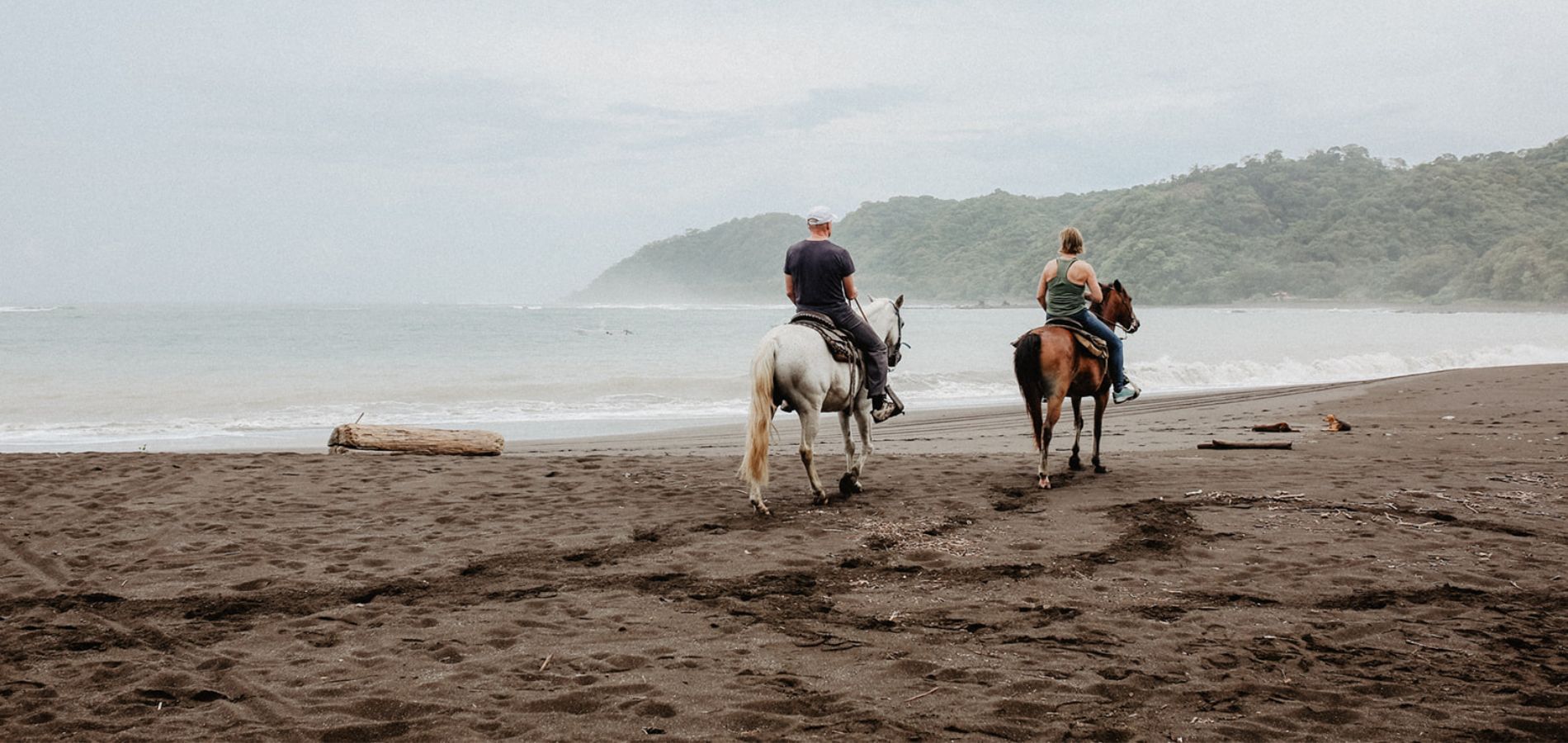 HazyHorseback_1900x900 Horseback riders on black sand beaches